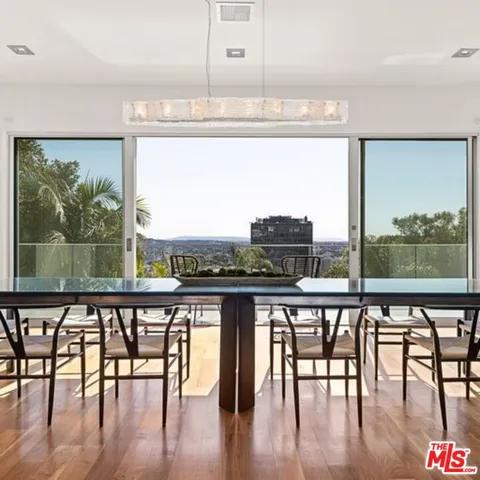 a view of a dining room with furniture window and outside view
