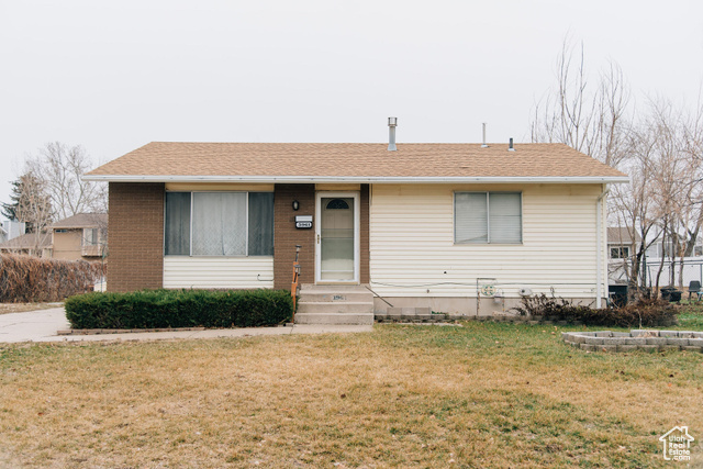 View of front of property with a front lawn