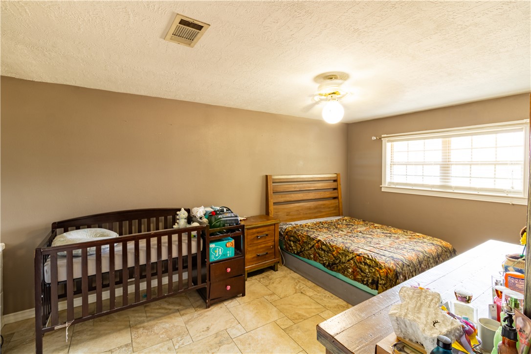 1214 Bittle Lane Bryan, TX 77801 - Photo 14 of 41 a bedroom with bed and a window