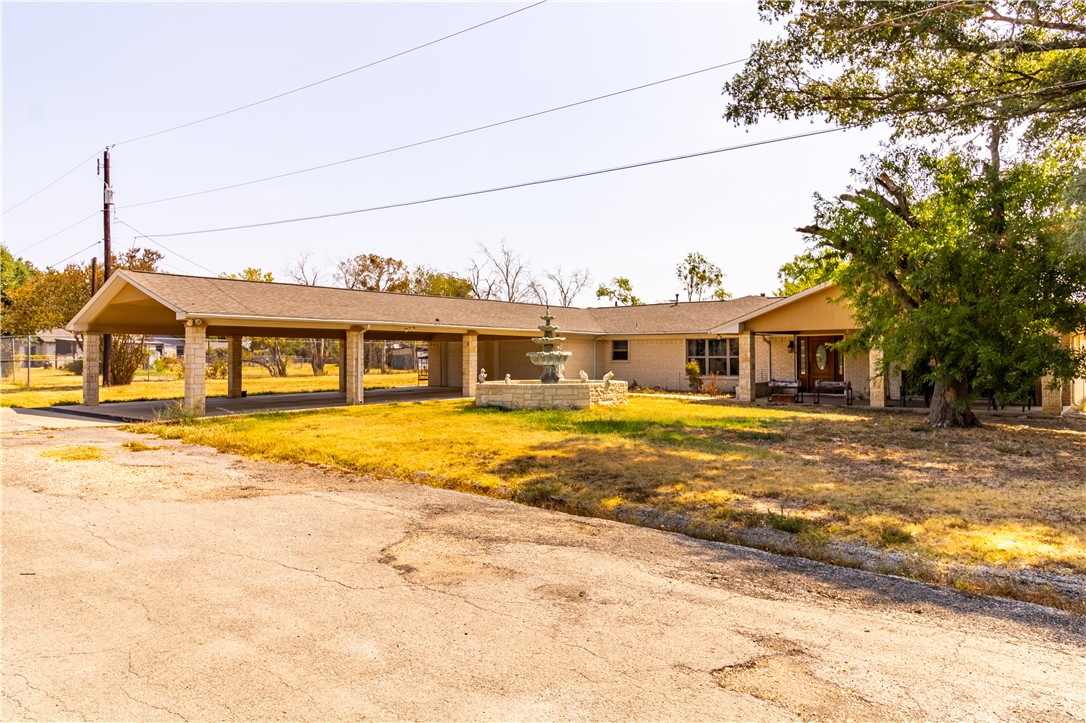 1214 Bittle Lane Bryan, TX 77801 - Photo 2 of 41 a front view of a house with a ocean view