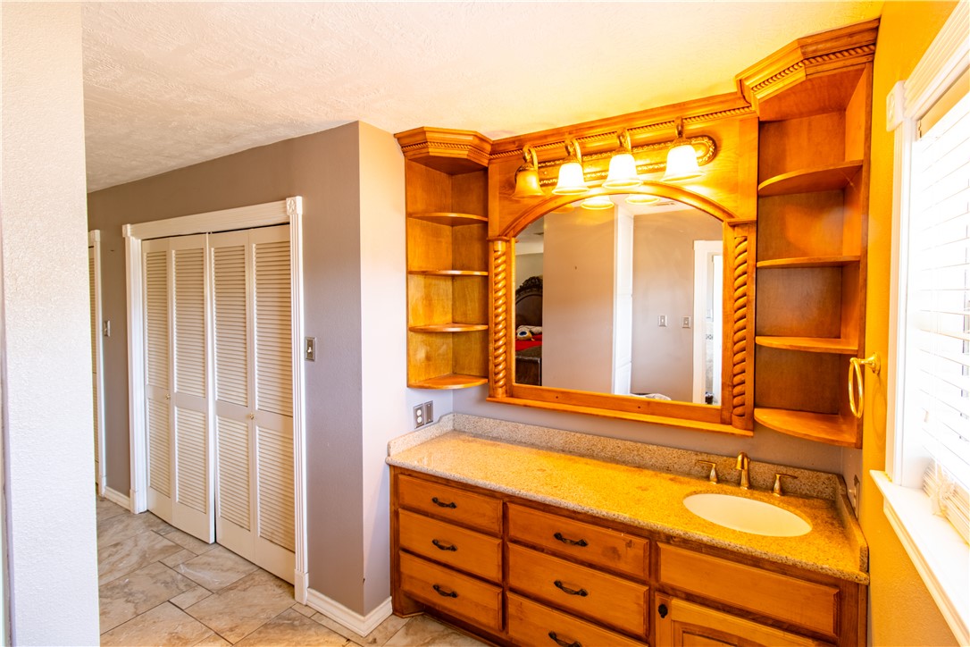 1214 Bittle Lane Bryan, TX 77801 - Photo 21 of 41 a bathroom with a sink and a mirror