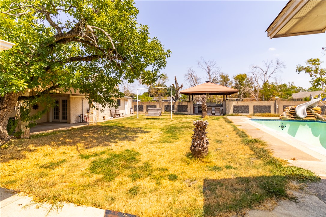 1214 Bittle Lane Bryan, TX 77801 - Photo 23 of 41 a swimming pool with outdoor seating and yard