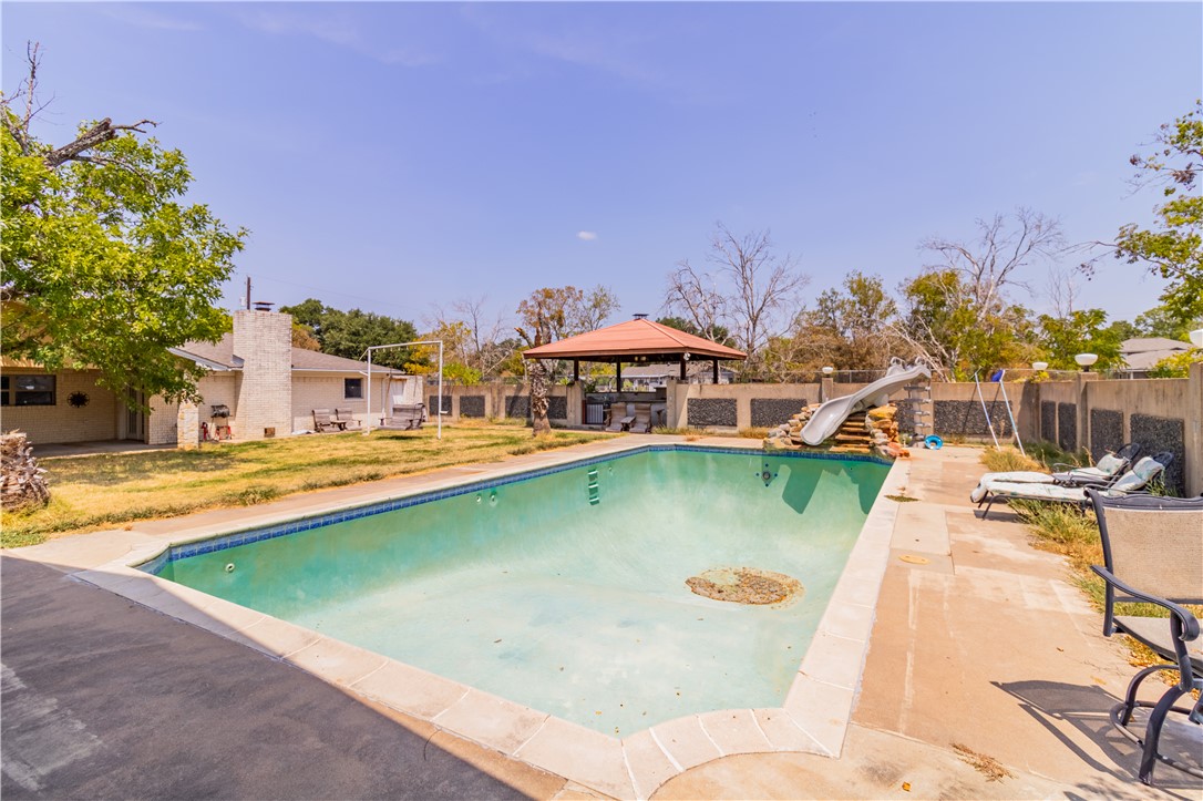 1214 Bittle Lane Bryan, TX 77801 - Photo 25 of 41 a view of a swimming pool with a lake view
