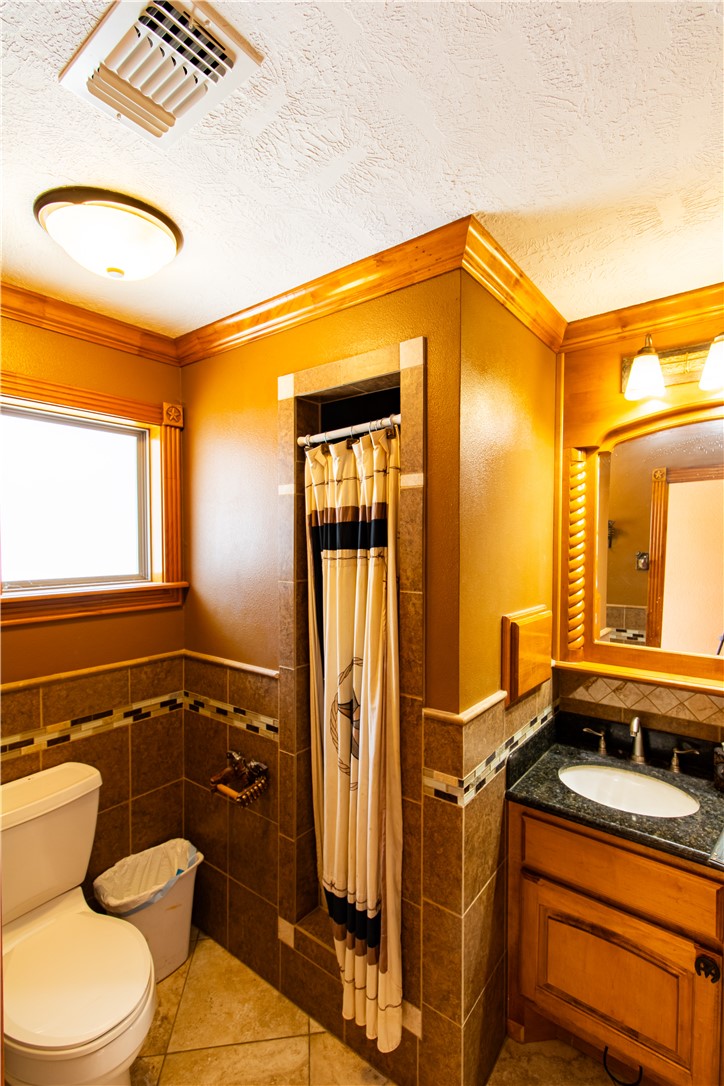 1214 Bittle Lane Bryan, TX 77801 - Photo 28 of 41 a bathroom with a sink a toilet and shower