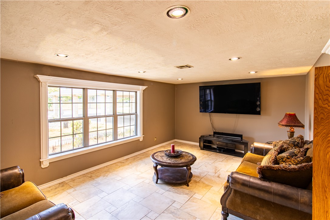 1214 Bittle Lane Bryan, TX 77801 - Photo 6 of 41 a living room with furniture and a flat screen tv
