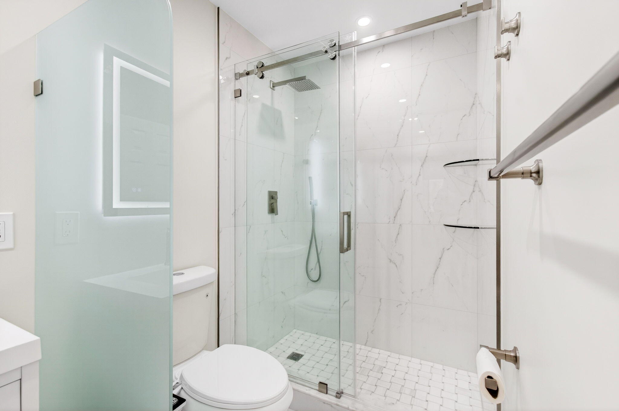 1330 Northwest 13th Street, Unit 12 Boca Raton, FL 33486 - Photo 28 of 52 a bathroom with a toilet and a shower