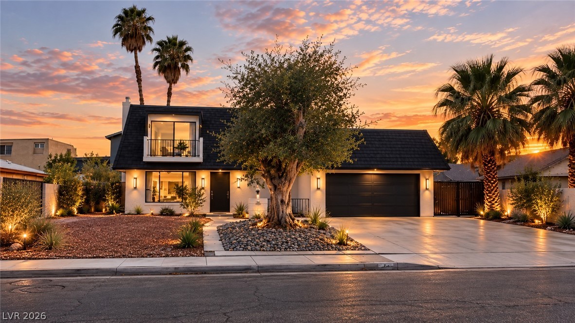 3019 South Topaz Road Las Vegas, NV 89121 - Photo 1 of 1 Palm trees and professional landscaping frame this striking multi-level exterior under a glowing twilight sky.