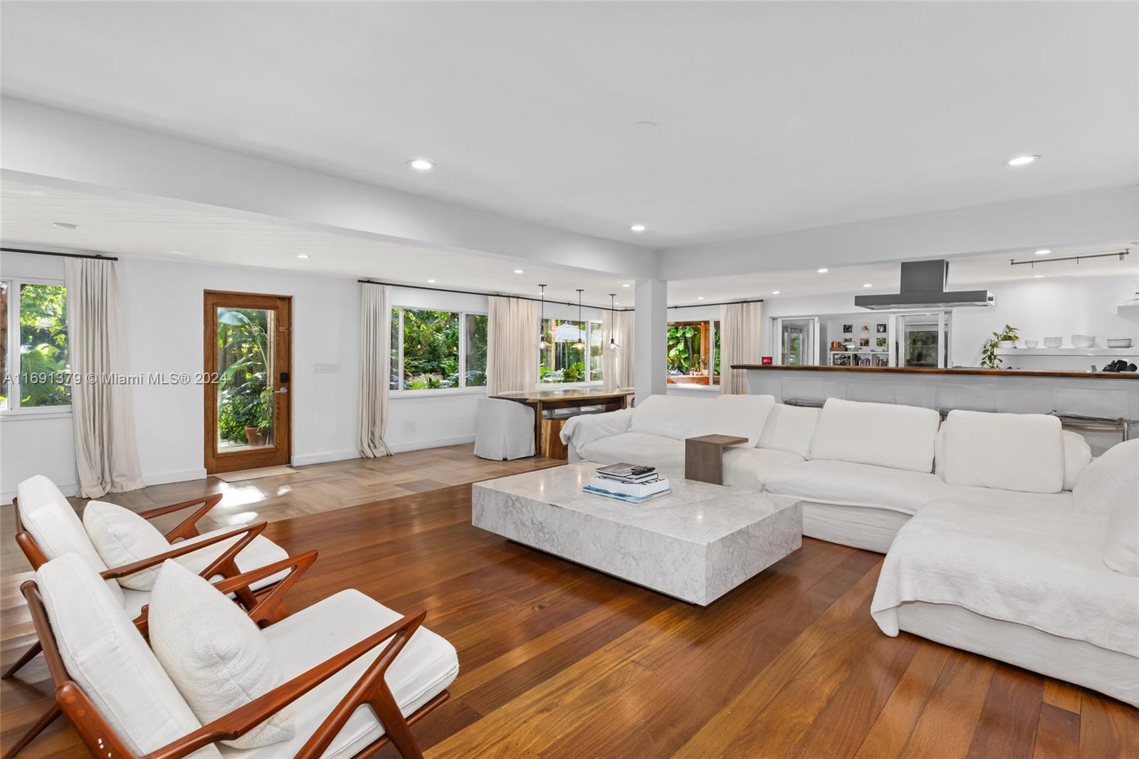 3685 St Gaudens Road Miami, FL 33133 - Photo 11 of 66 a living room with furniture and wooden floor