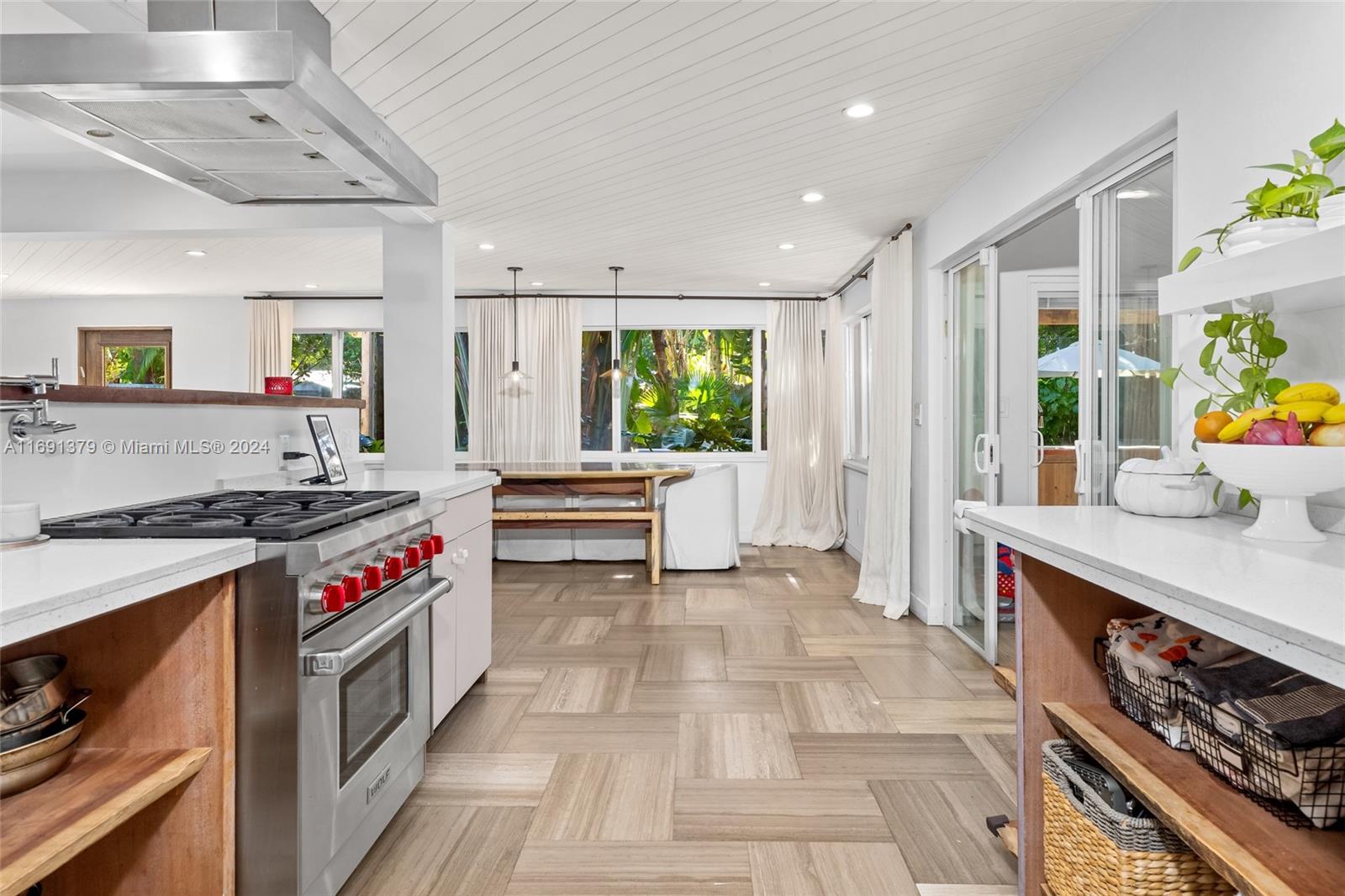 3685 St Gaudens Road Miami, FL 33133 - Photo 15 of 66 a kitchen with stainless steel appliances granite countertop a stove and a sink