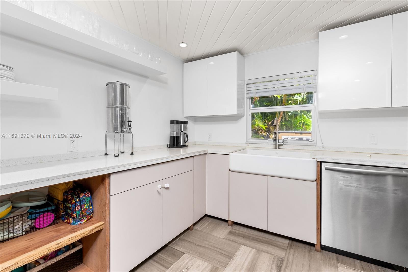 3685 St Gaudens Road Miami, FL 33133 - Photo 20 of 66 a kitchen with appliances cabinets and a sink