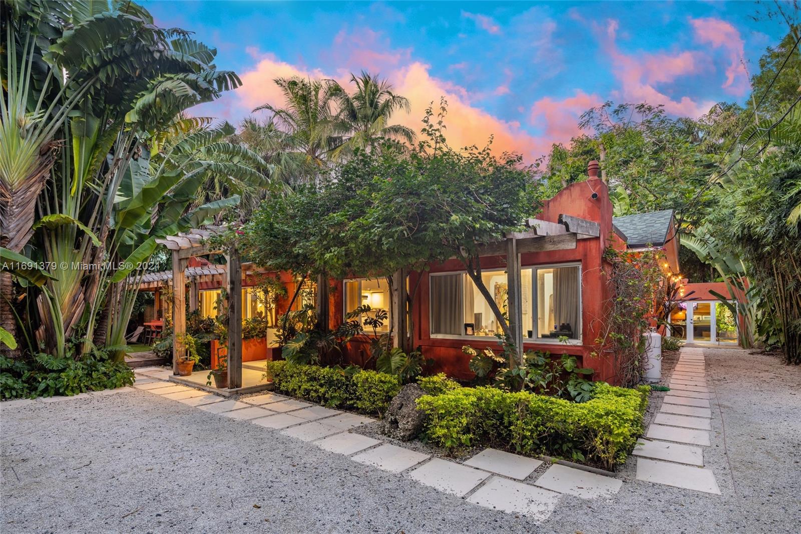 3685 St Gaudens Road Miami, FL 33133 - Photo 2 of 66 a front view of a house with a yard