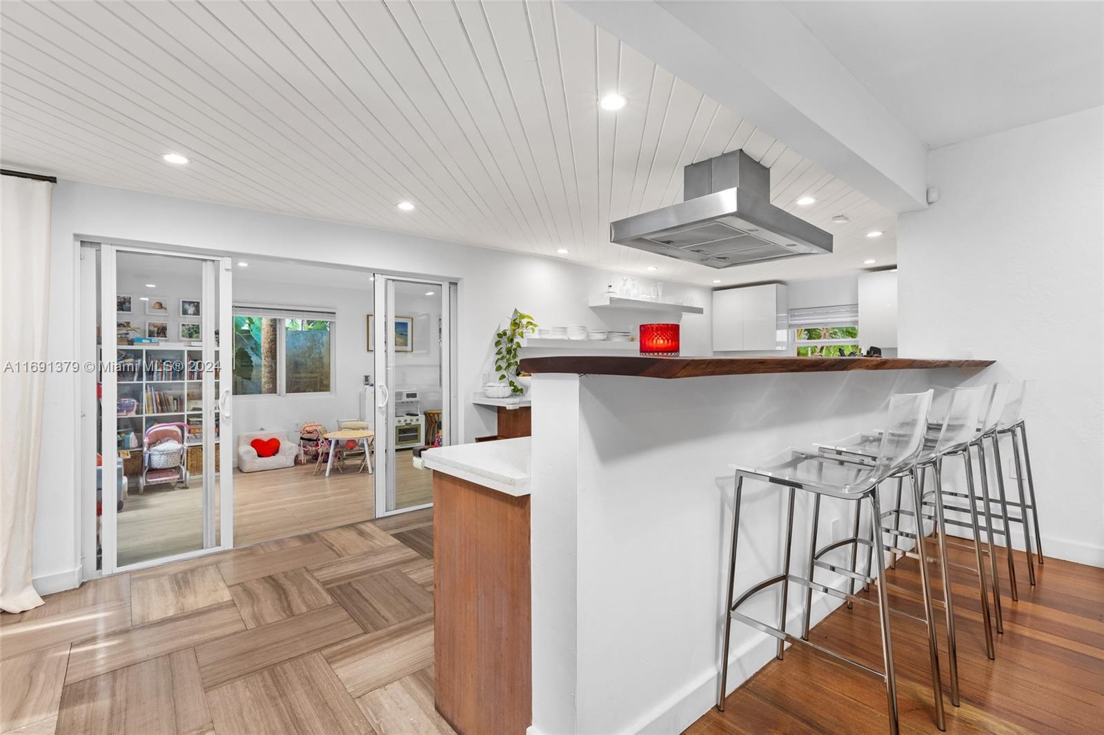 3685 St Gaudens Road Miami, FL 33133 - Photo 21 of 66 a kitchen that has a lot of cabinets in it