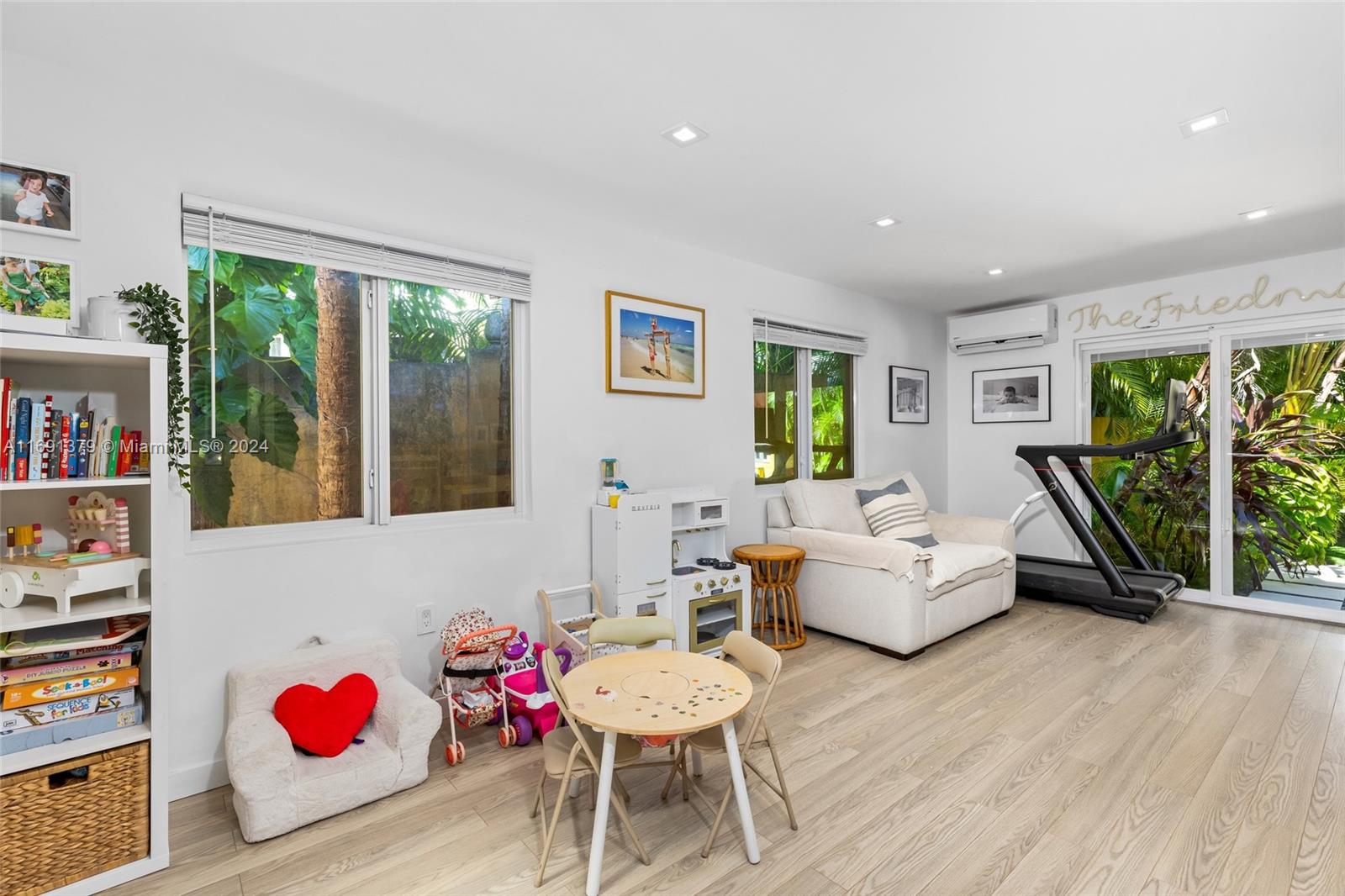 3685 St Gaudens Road Miami, FL 33133 - Photo 22 of 66 a living room with furniture and a large window
