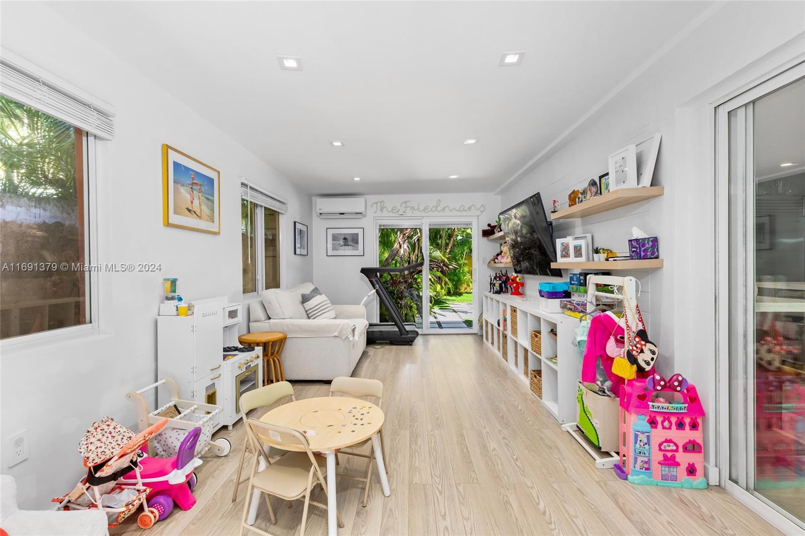 3685 St Gaudens Road Miami, FL 33133 - Photo 23 of 66 a living room with furniture and a couch