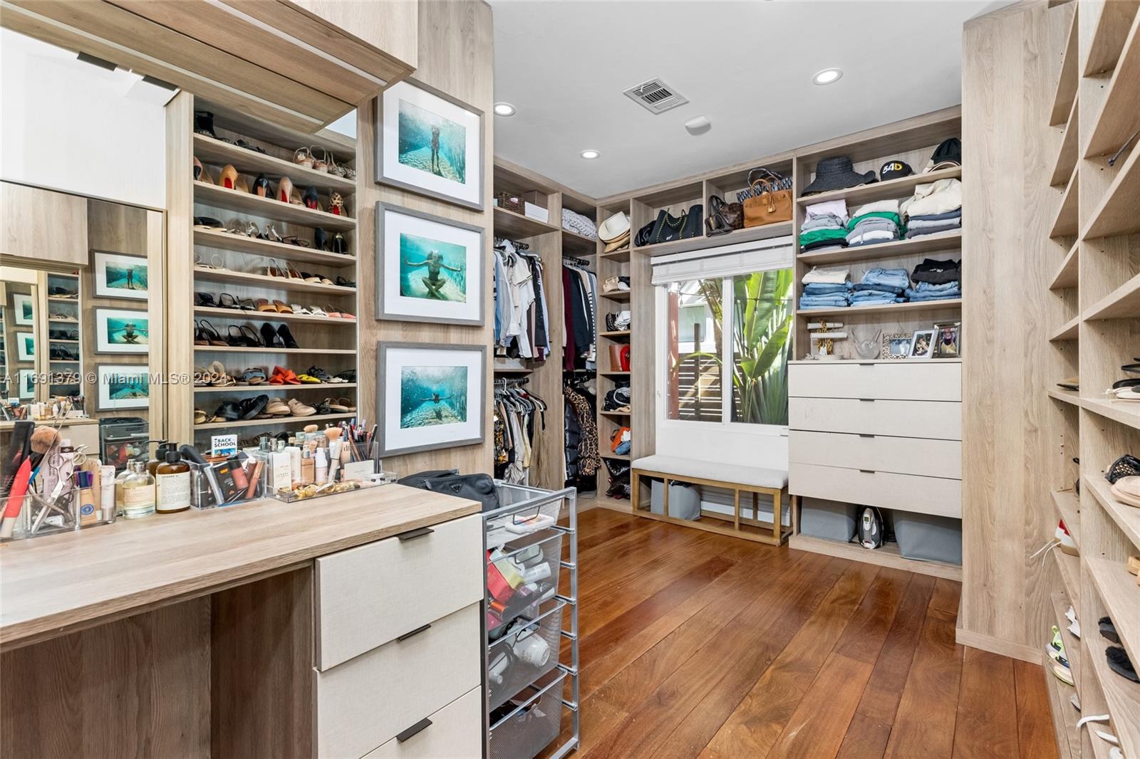 3685 St Gaudens Road Miami, FL 33133 - Photo 27 of 66 a hallway with a large window and a wooden floor