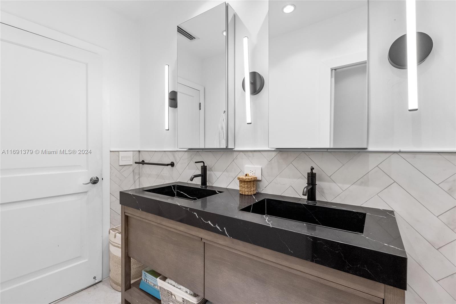 3685 St Gaudens Road Miami, FL 33133 - Photo 31 of 66 a kitchen with a sink and cabinets