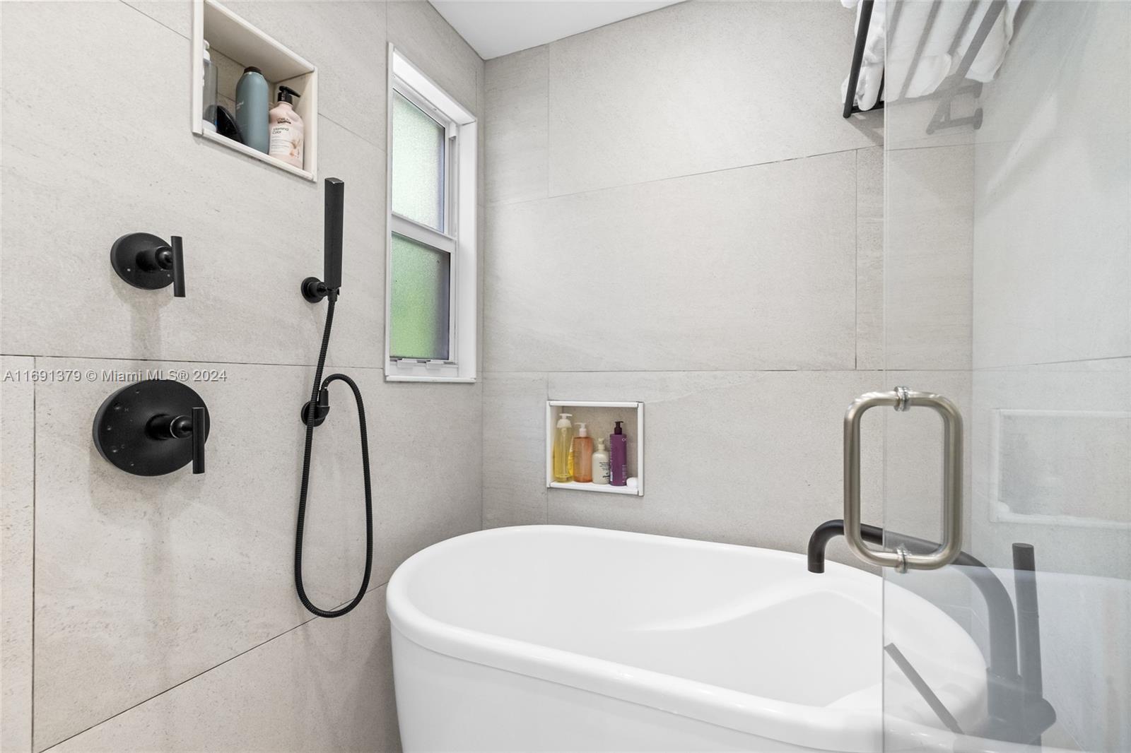 3685 St Gaudens Road Miami, FL 33133 - Photo 32 of 66 a bathroom with a sink and mirror