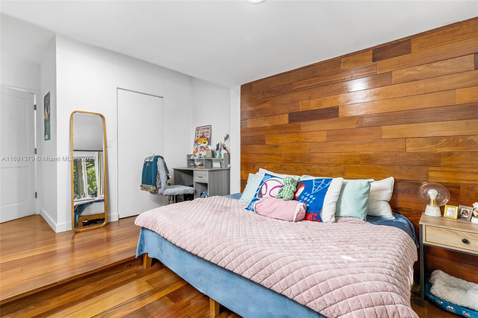 3685 St Gaudens Road Miami, FL 33133 - Photo 34 of 66 a bedroom with a bed and wooden floor