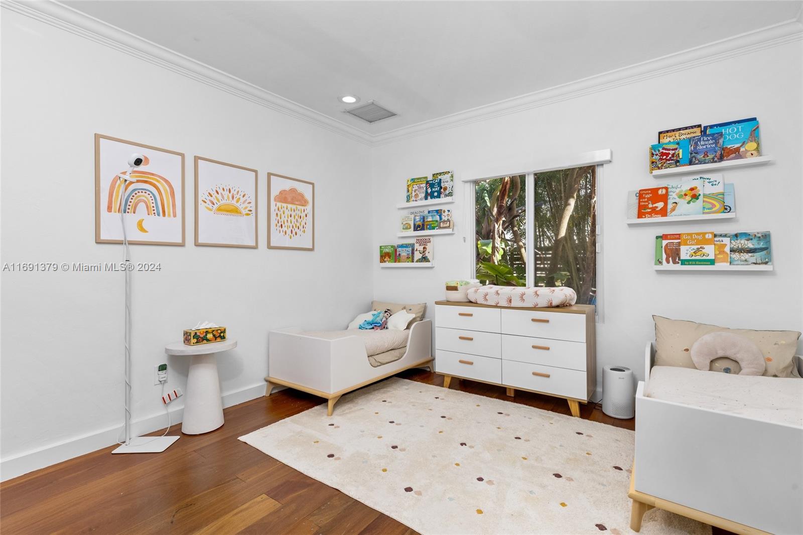 3685 St Gaudens Road Miami, FL 33133 - Photo 36 of 66 a bedroom with a bed and wooden floor