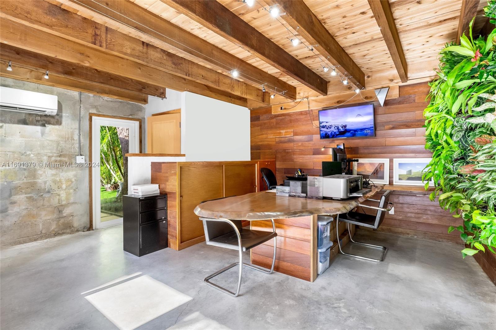 3685 St Gaudens Road Miami, FL 33133 - Photo 39 of 66 a outdoor space with lots of tables a garden view and a couch