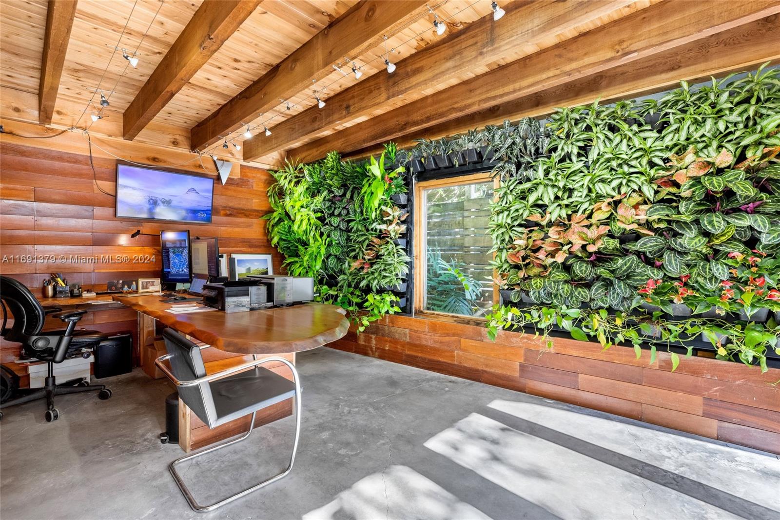 3685 St Gaudens Road Miami, FL 33133 - Photo 40 of 66 a room with patio furniture and a potted plant