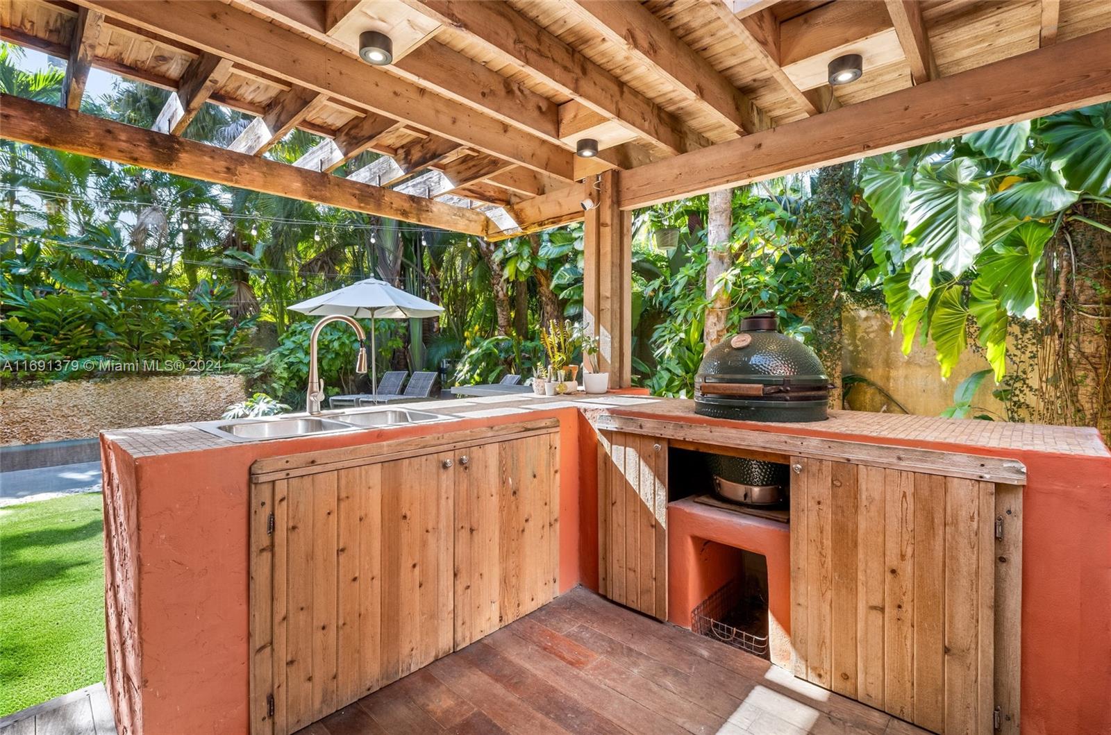 3685 St Gaudens Road Miami, FL 33133 - Photo 47 of 66 a view of outdoor kitchen from a tub