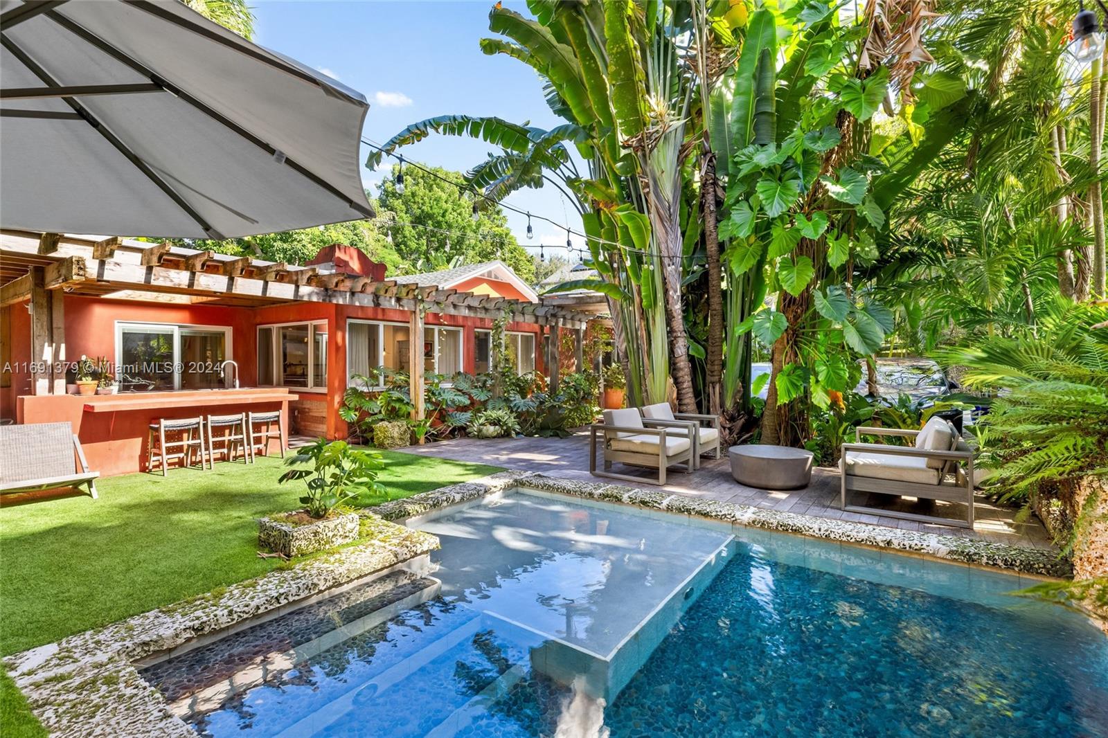 3685 St Gaudens Road Miami, FL 33133 - Photo 50 of 66 a view of a backyard with sitting area