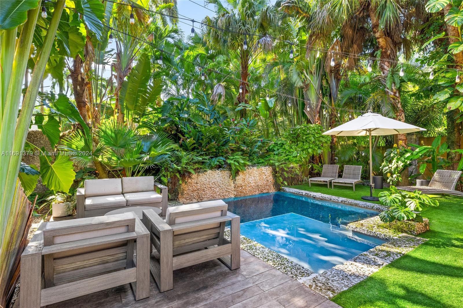 3685 St Gaudens Road Miami, FL 33133 - Photo 51 of 66 a view of a backyard with sitting area and furniture