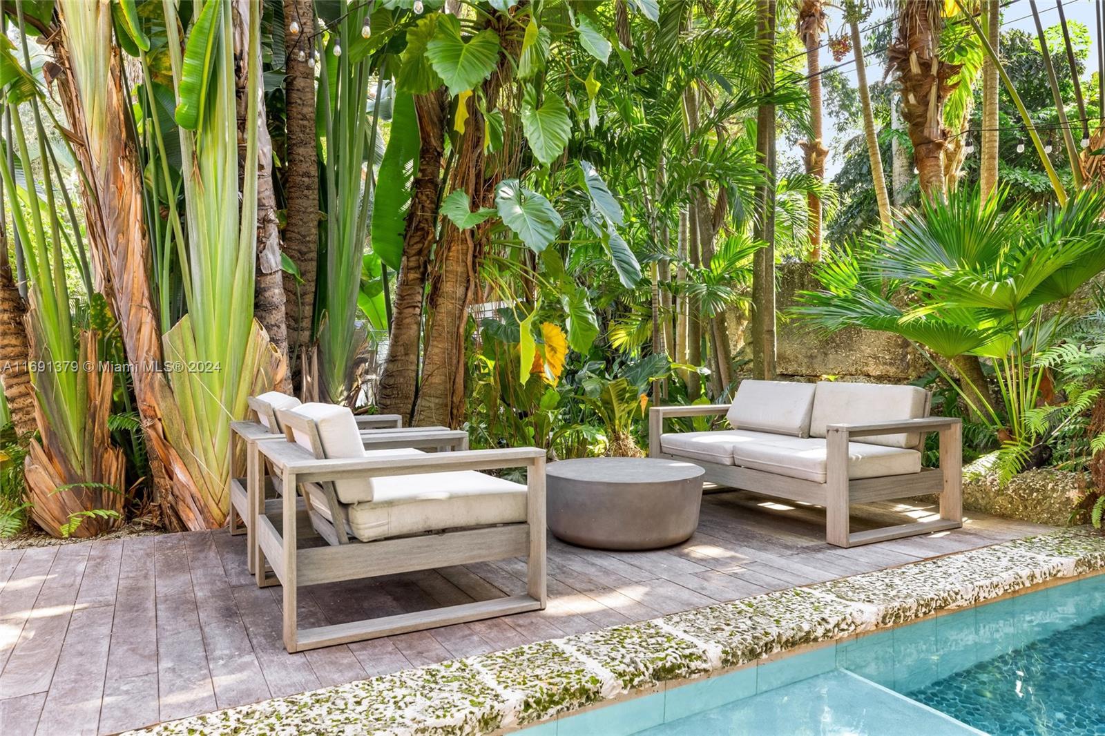3685 St Gaudens Road Miami, FL 33133 - Photo 52 of 66 a living room with patio furniture and a potted plants