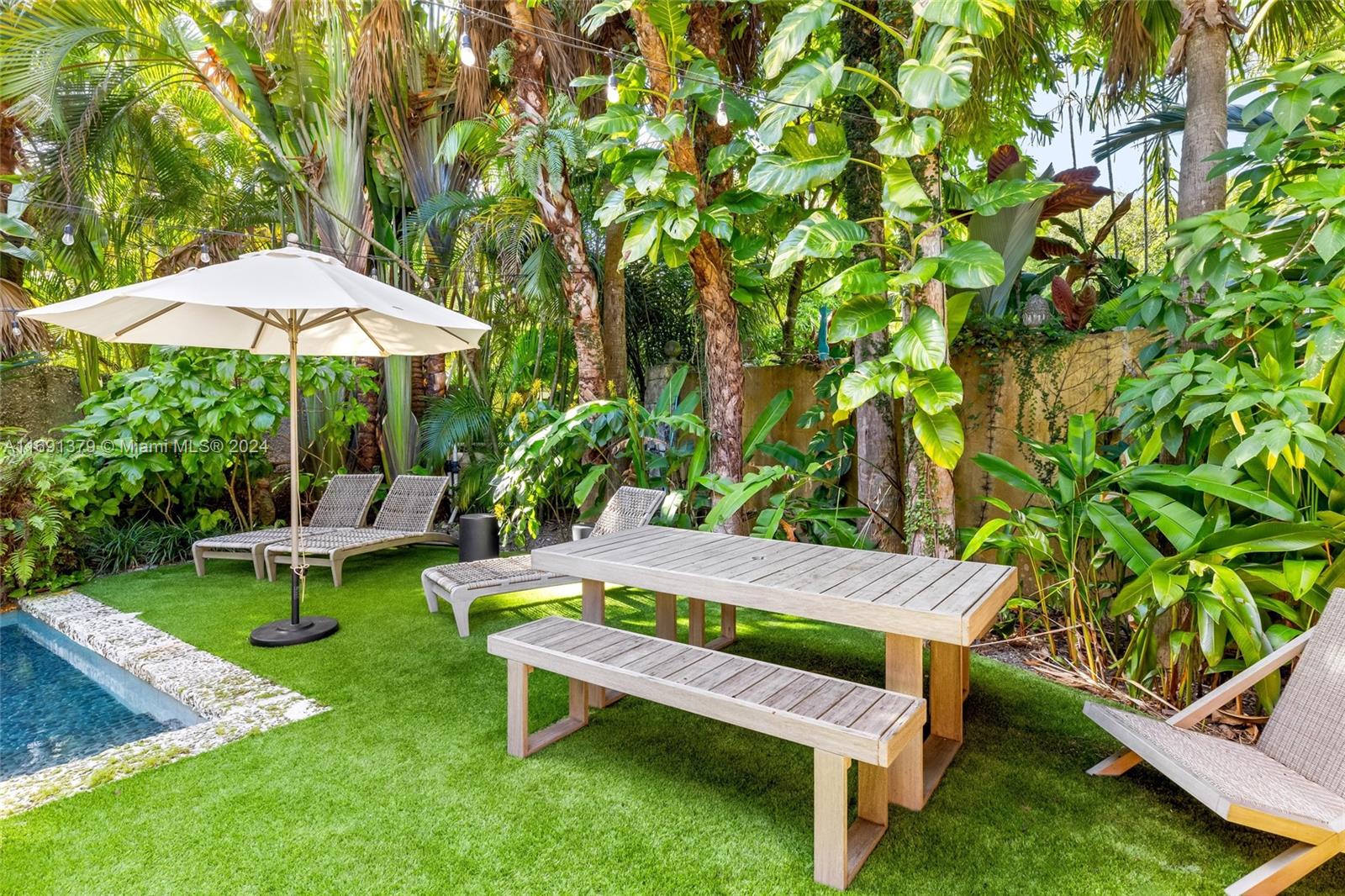 3685 St Gaudens Road Miami, FL 33133 - Photo 55 of 66 a view of a backyard with chairs