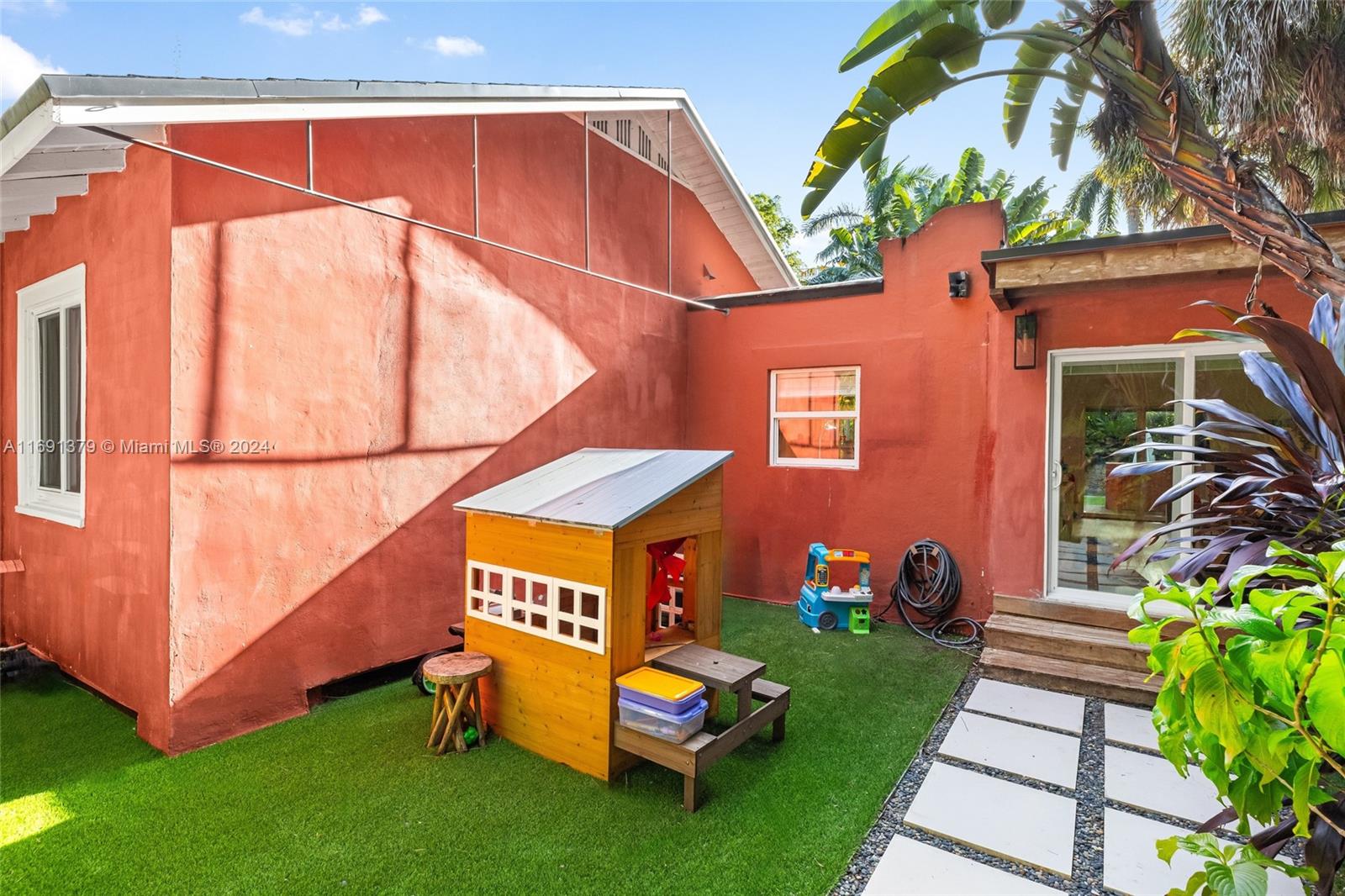 3685 St Gaudens Road Miami, FL 33133 - Photo 57 of 66 a backyard of a house with seating space