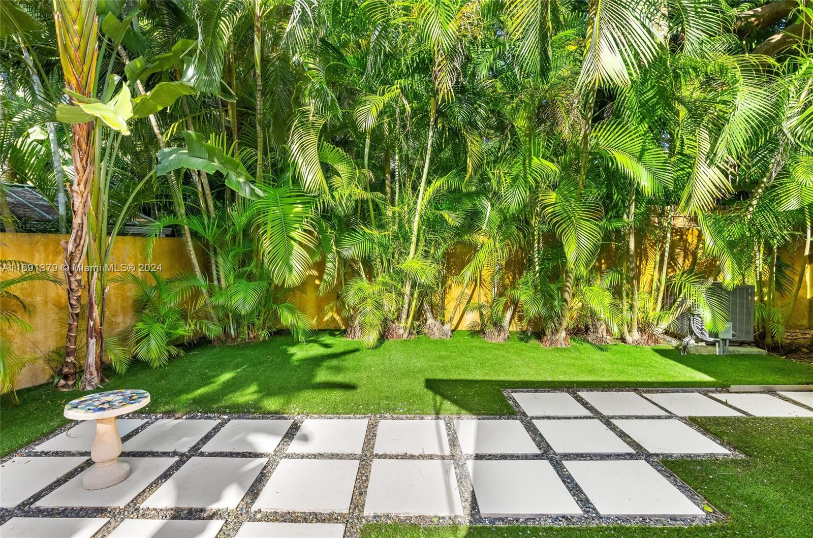 3685 St Gaudens Road Miami, FL 33133 - Photo 59 of 66 a view of a backyard with a garden