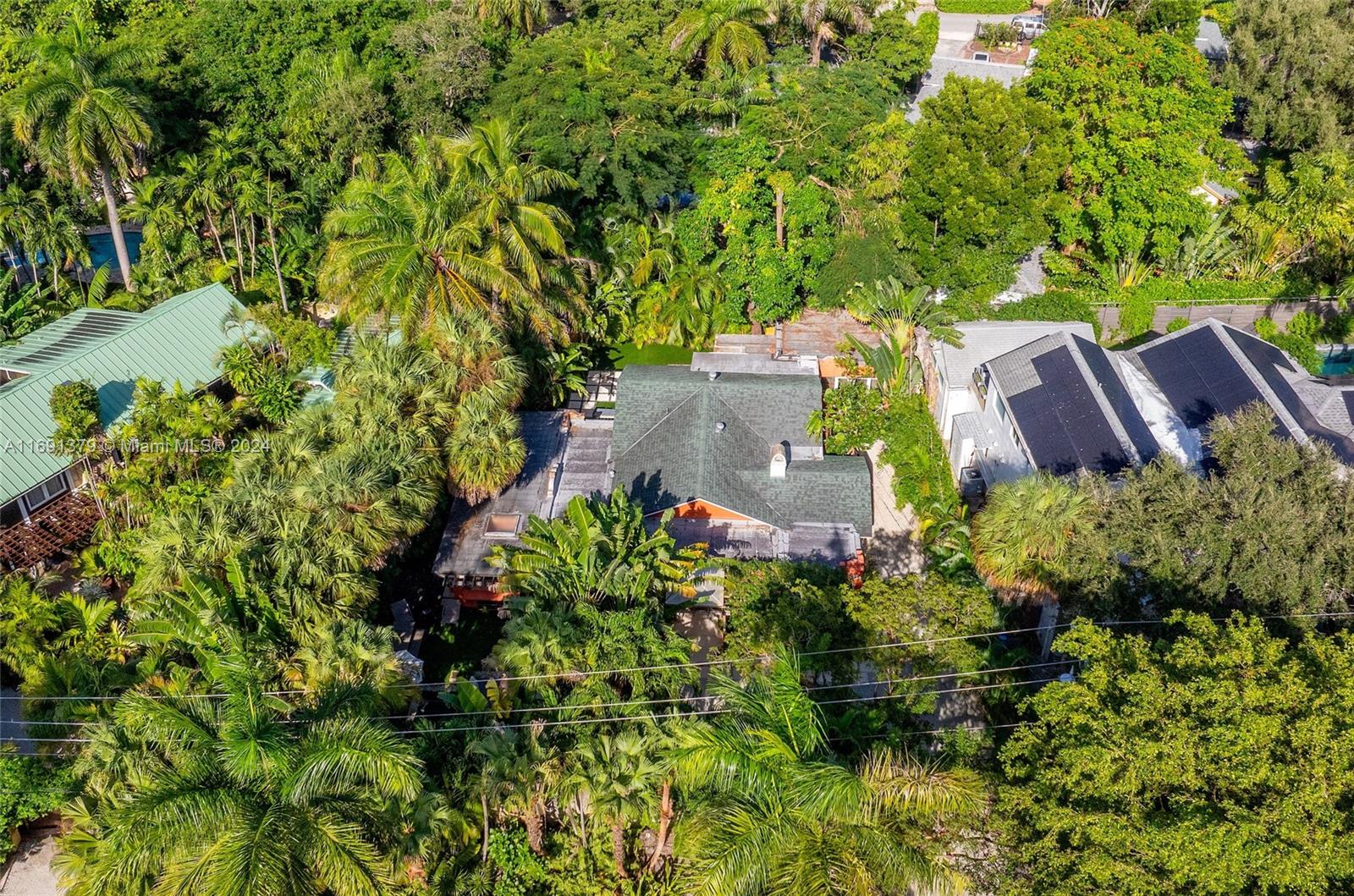 3685 St Gaudens Road Miami, FL 33133 - Photo 64 of 66 an aerial view of a house with a yard and garden