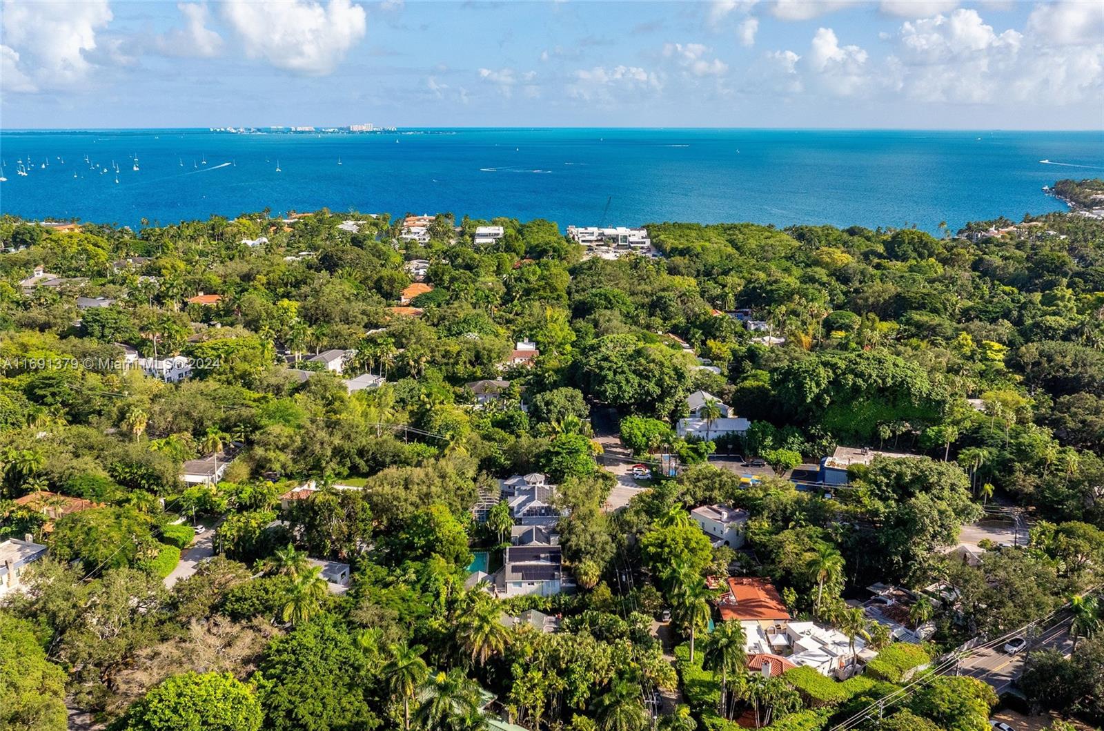 3685 St Gaudens Road Miami, FL 33133 - Photo 65 of 66 a view of a houses with a lake view