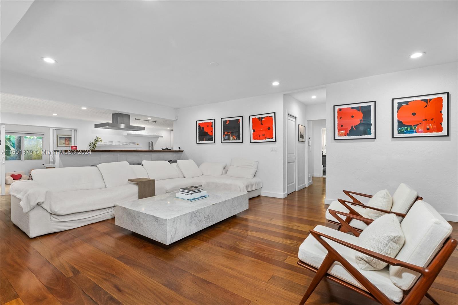3685 St Gaudens Road Miami, FL 33133 - Photo 8 of 66 a living room with furniture and a view of kitchen
