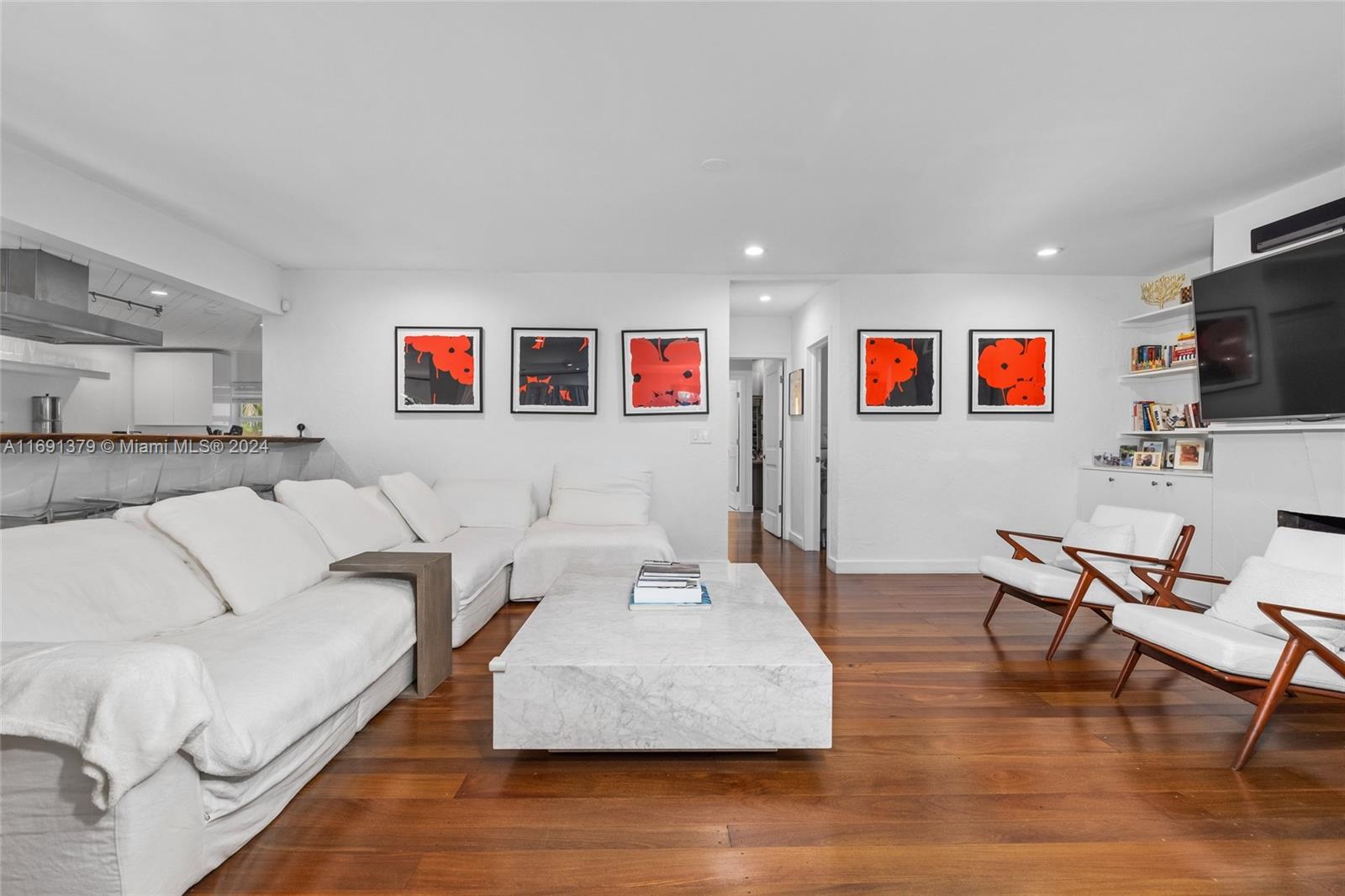 3685 St Gaudens Road Miami, FL 33133 - Photo 9 of 66 a living room with furniture and a flat screen tv