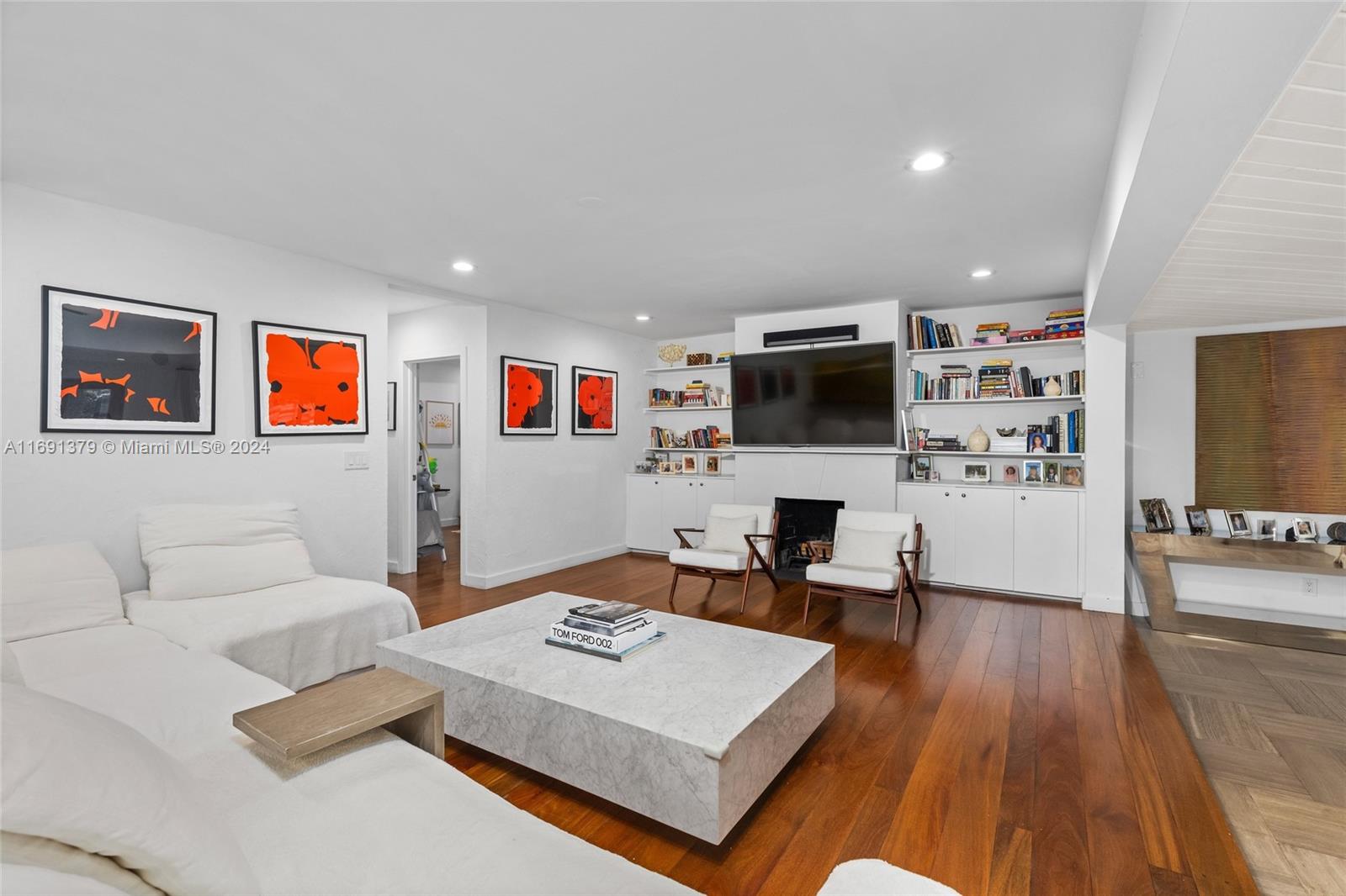 3685 St Gaudens Road Miami, FL 33133 - Photo 10 of 66 a living room with furniture and a flat screen tv