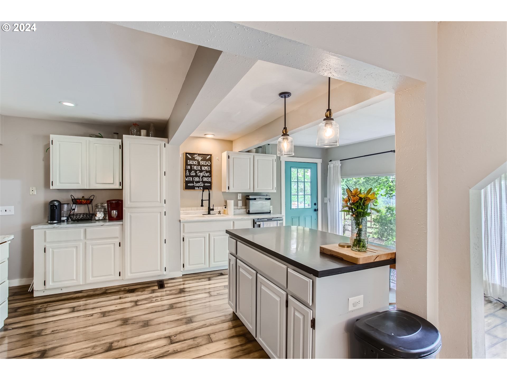 32825 Southwest Ladd Hill Road Wilsonville, OR 97070 - Photo 11 of 23 a kitchen with white cabinets and appliances