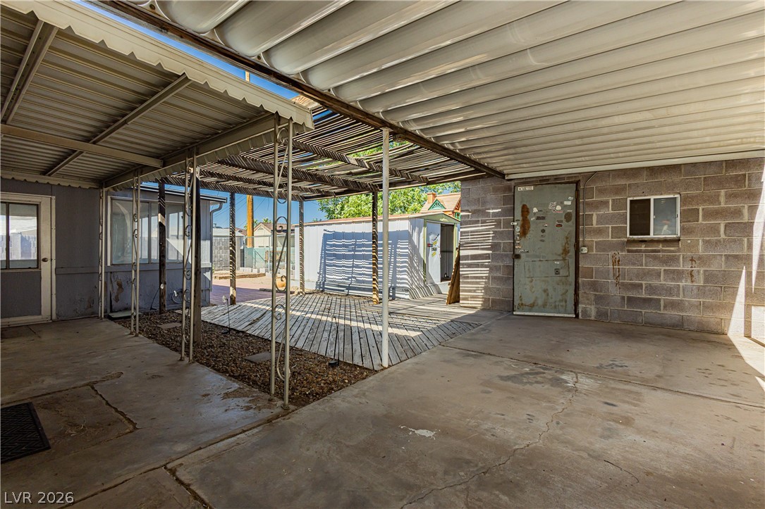 306 Dell Way Henderson, NV 89015 - Photo 21 of 29 Covered Carport, Covered Back Patio area * Solid Structure Workshop in Back.