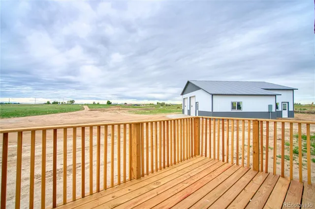 a balcony view with wooden floor