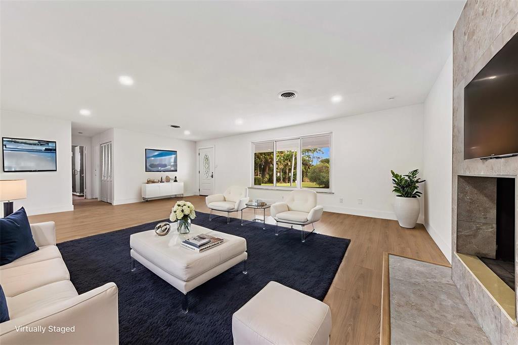 1822 Banyan Tree Drive Edgewater, FL 32132 - Photo 12 of 63 a living room with furniture and a flat screen tv