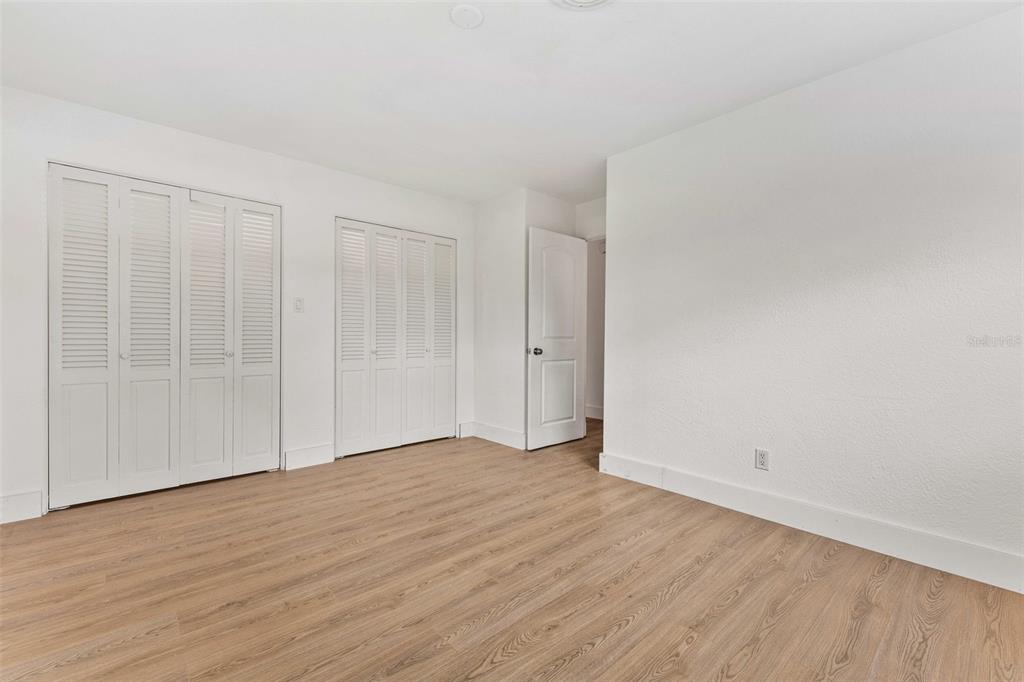 1822 Banyan Tree Drive Edgewater, FL 32132 - Photo 17 of 63 a view of an empty room with wooden floor