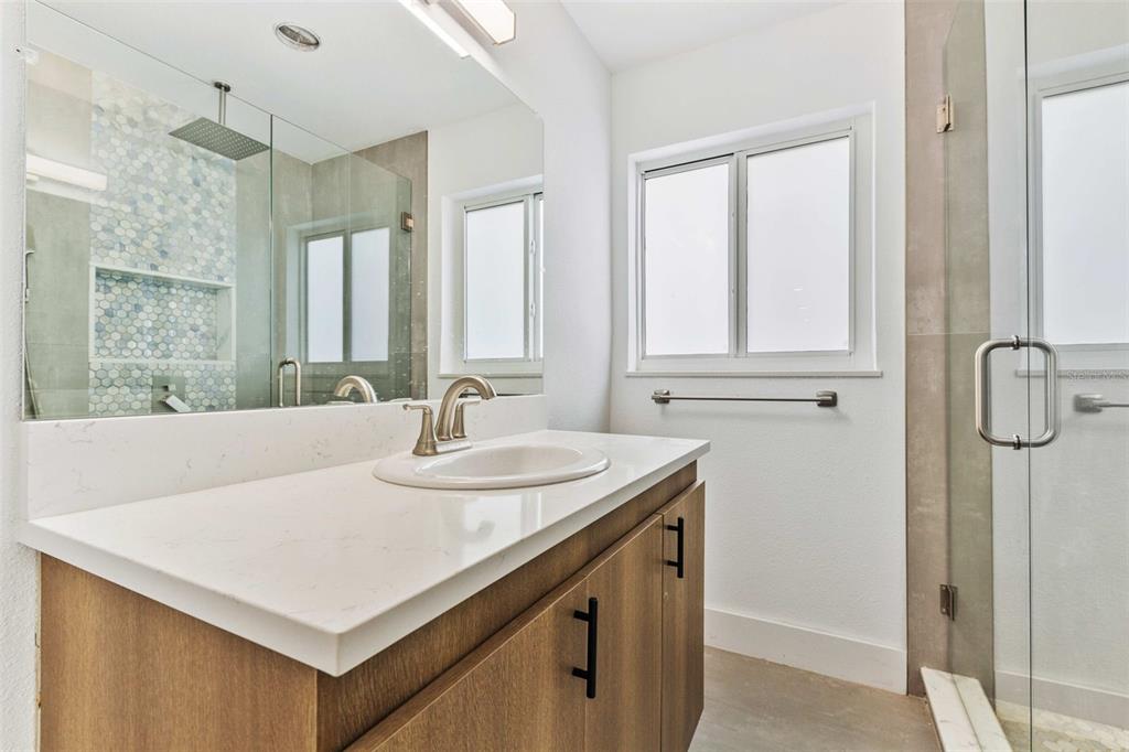 1822 Banyan Tree Drive Edgewater, FL 32132 - Photo 18 of 63 a bathroom with a sink vanity and a mirror