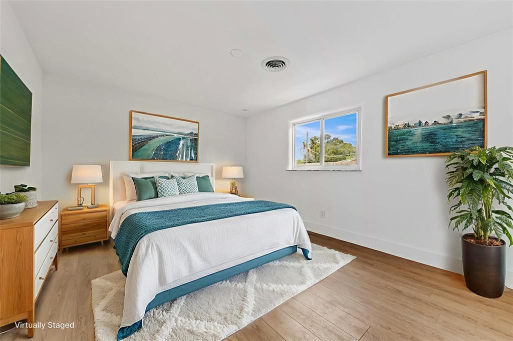 1822 Banyan Tree Drive Edgewater, FL 32132 - Photo 20 of 63 a bedroom with bed and a painting on the wall