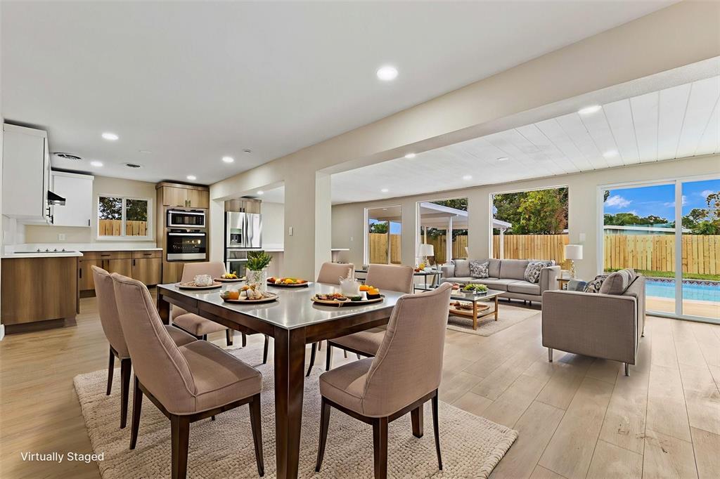 1822 Banyan Tree Drive Edgewater, FL 32132 - Photo 24 of 63 a view of a dining room with furniture and wooden floor