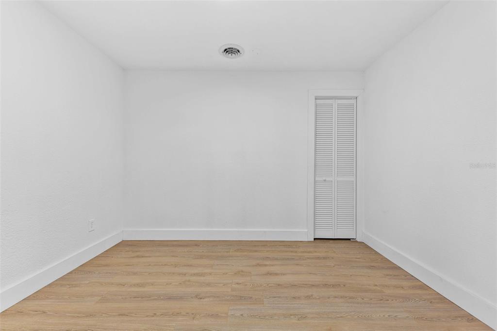1822 Banyan Tree Drive Edgewater, FL 32132 - Photo 33 of 63 a view of an empty room with wooden floor