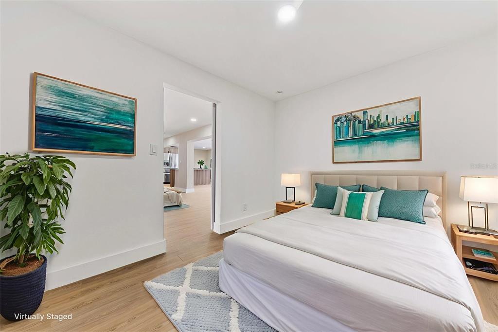 1822 Banyan Tree Drive Edgewater, FL 32132 - Photo 34 of 63 a bedroom with bed and a potted plant