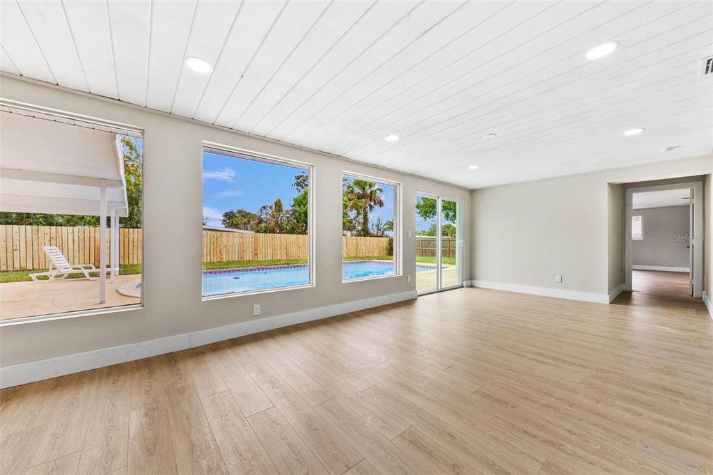 1822 Banyan Tree Drive Edgewater, FL 32132 - Photo 46 of 63 a view of an empty room with window and wooden floor