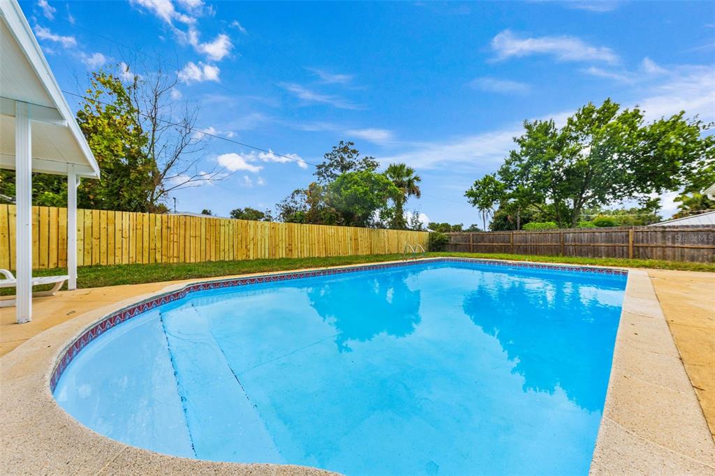 1822 Banyan Tree Drive Edgewater, FL 32132 - Photo 57 of 63 a view of a swimming pool with a backyard