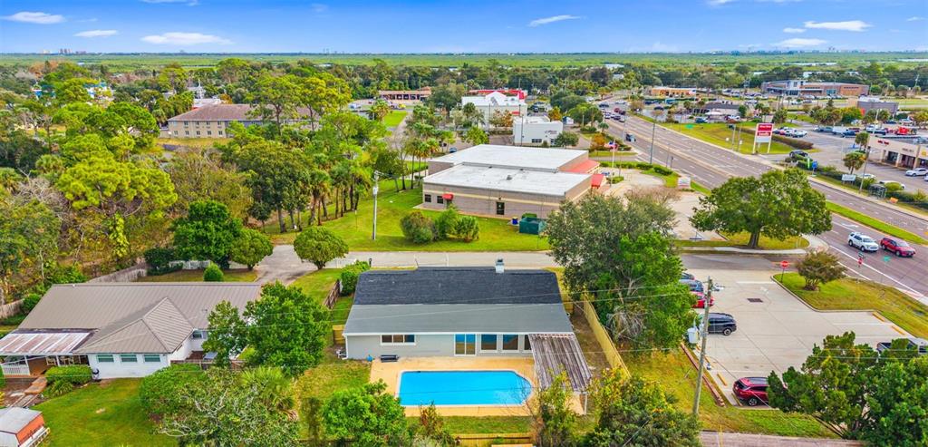 1822 Banyan Tree Drive Edgewater, FL 32132 - Photo 63 of 63 an aerial view of residential houses with outdoor space and swimming pool